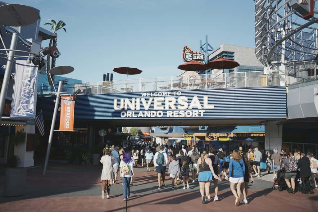 Crowd of visitors entering Universal Orlando Resort theme park.